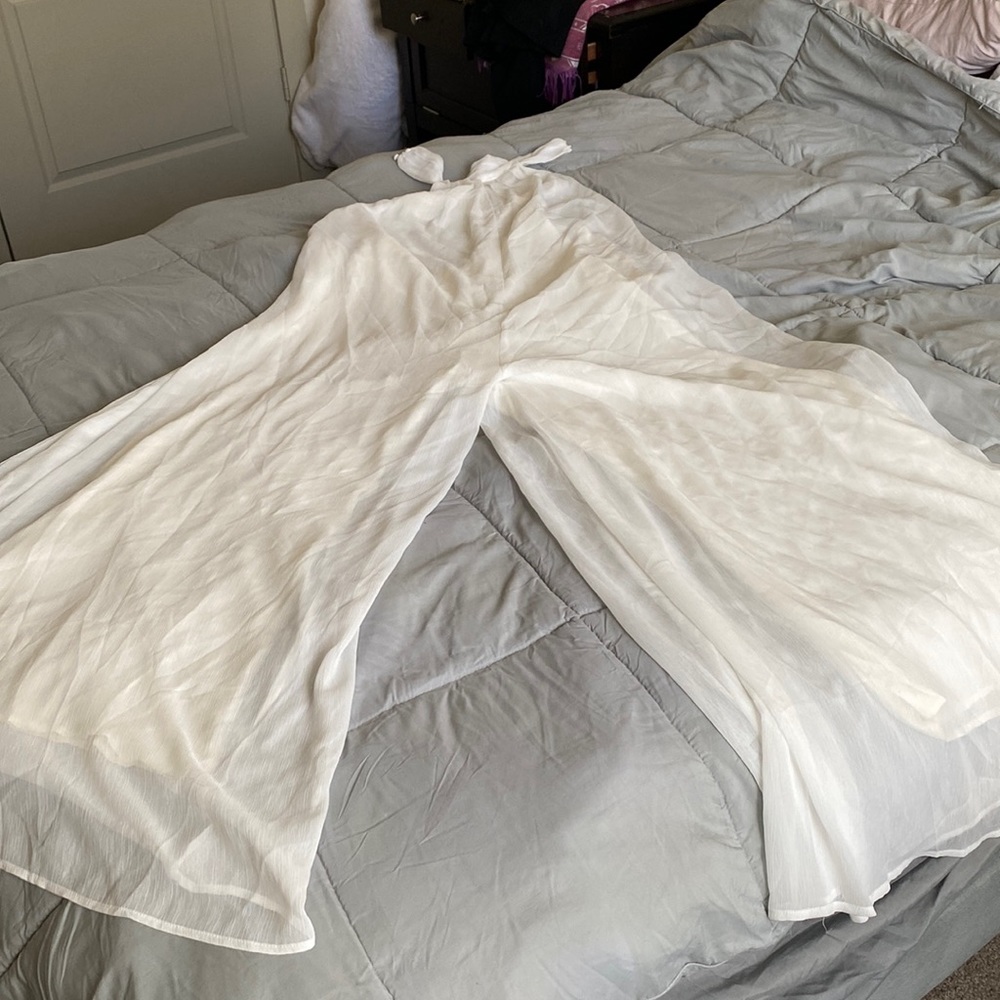 Never worn, high neck, cream color wide leg halter.